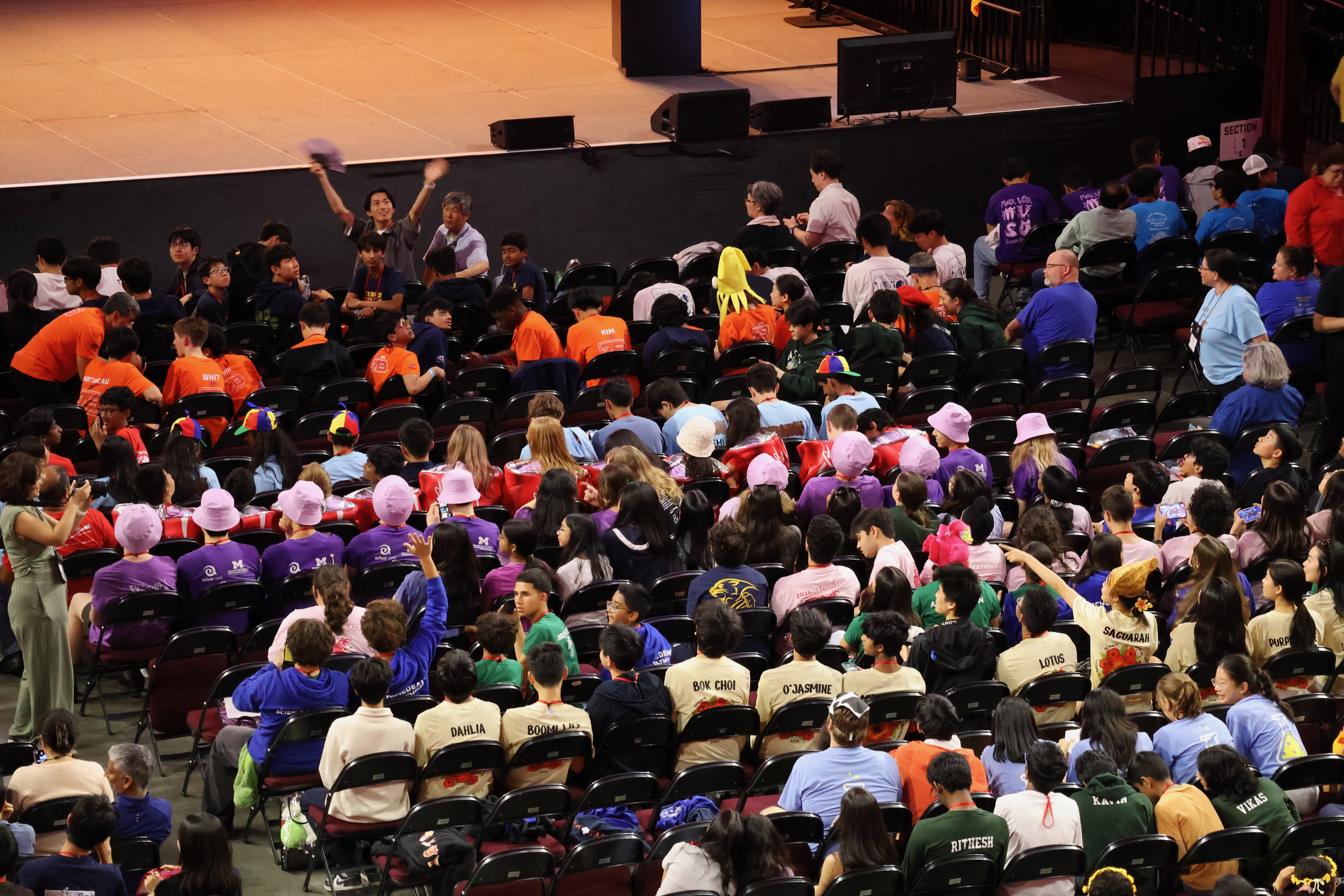Pioneer Science Olympiad students gathered around a table during Nationals travel.